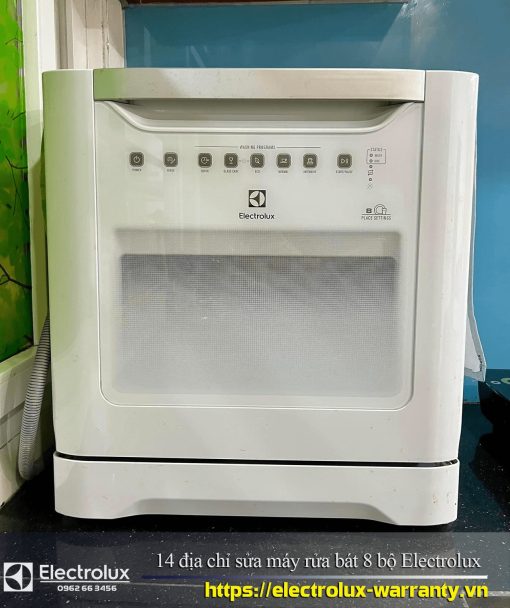 Drum washing machine Electrolux 8 sets, front view, compact laundry appliance with control panel in a modern laundry room, showcasing durability and reliable Electrolux warranty service.