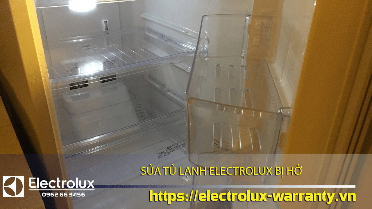 Damaged Electrolux refrigerator interior with broken door and exposed shelves, highlighting the importance of warranty service and repair support from Electrolux in Vietnam.